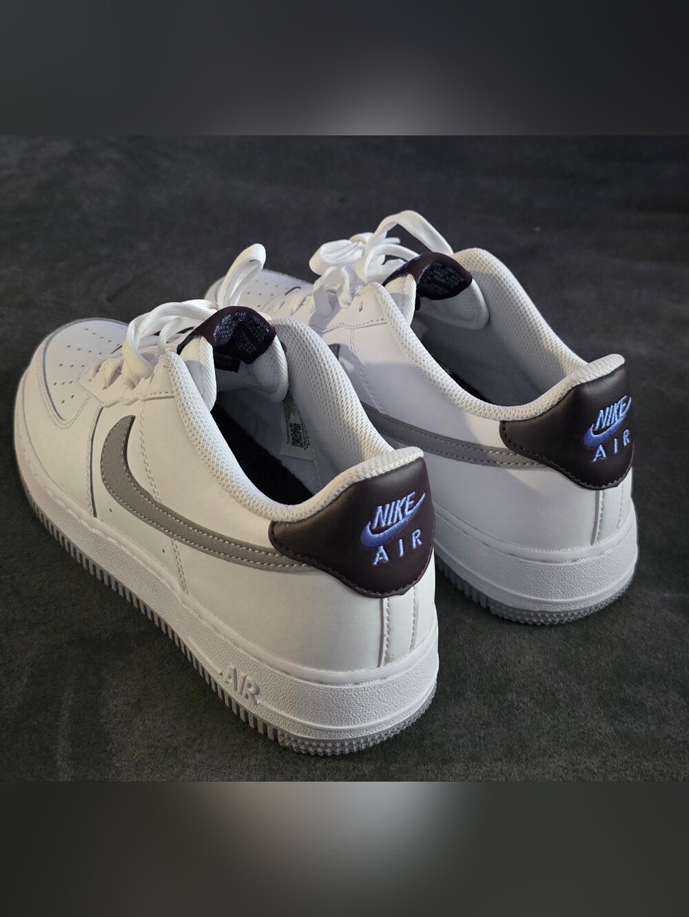 These are Nike Air Force 1 GS White Cement Grey sneakers with a white, burgundy